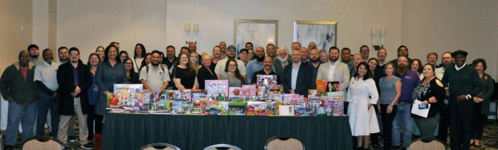 CSCRC staff and delegates with some of the toys that were donated to Toys for Tots